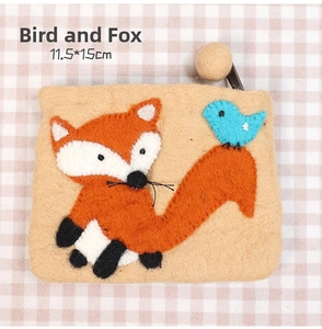 Detail of wool felt fox coin purse with wooden bead zipper and 11.5x15cm size specs