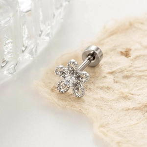 Minimalist silver flower stud earring with central gemstone and flat screw back closure