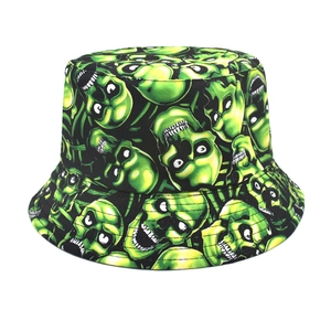 Close-up of black bucket hat with vibrant neon green skull patterns and print detail