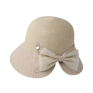 Chapeau de soleil élégant en paille beige pour femme avec un grand nœud en mousseline