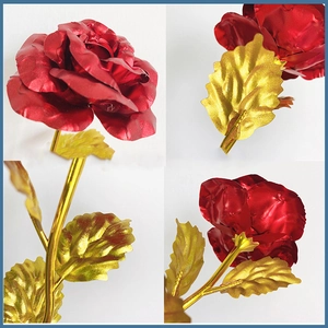 Close-up of golden red foil rose showing detailed petals and gold leaf stem craft