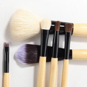 Set of 9 professional wool makeup brushes with wooden handles and a black metal ferrule