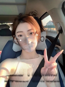 Close-up of UPF 50+ silk sun protection mask covering the eyes and face in a car