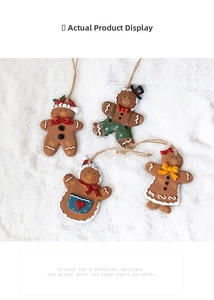 Detail of four gingerbread man ornaments with distinct outfits on snowy background