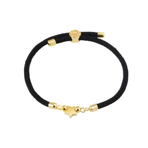 Detail of adjustable star charm bracelet with black woven cord and gold-plated hardware