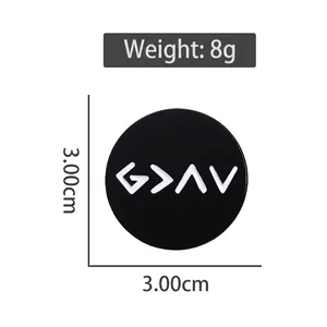 Round metal badge pin with God is Greater than the Highs and Lows symbol in black