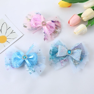 Sparkly mesh bow hair clips for girls with sequins, rhinestones and snowflake patterns