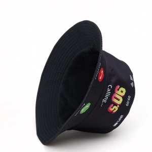 Detail of retro 90's phone call print on black bucket hat with vintage graphic pattern