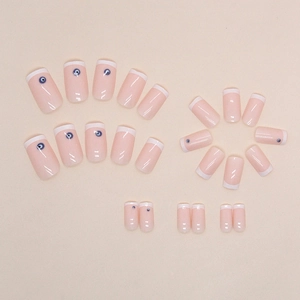 White French press-on nails with blue Evil Eye design and nude base, 24 pieces set