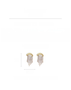 Detail view of gold tassel moon earrings with dimensions 5cm by 2.6cm and 15.4g weight