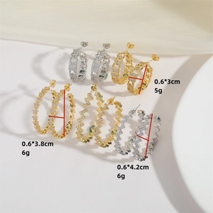 Elegant C-shaped earrings with inlaid zircon crystals in gold and silver finishes