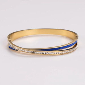 Elegant gold-plated stainless steel wrapped bangle with blue enamel and crystal inlay