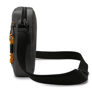 Grey Oxford fabric crossbody bag for men featuring adjustable strap and yellow zipper cords