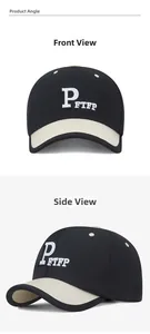 Detailed close-up of 3D embroidered letters on a black and beige baseball cap