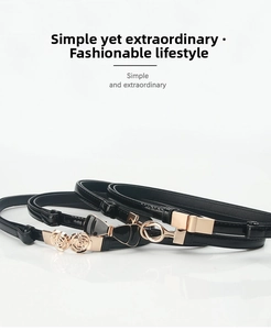 Three-piece set of slim black waist belts with gold floral, bow, and geometric buckles