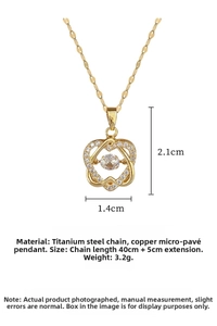 Detailed view of intertwined heart pendant with micro-pave cubic zirconia on gold chain