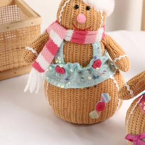Charming gingerbread man plush doll with blue sequined dress and festive knit scarf