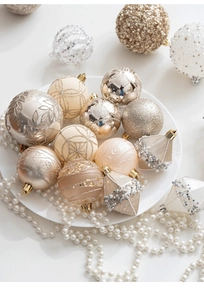 Detailed view of luxury champagne and silver painted Christmas ornaments with pearl accents