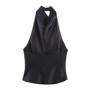 Detail of black satin halter top featuring a backless cut and silky smooth texture