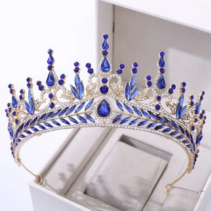 Detailed close-up of a blue crystal bridal crown with water-drop stones in a luxury box