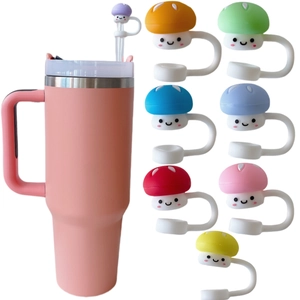 Pink tumbler with eight colorful mushroom-shaped silicone straw covers for dust protection