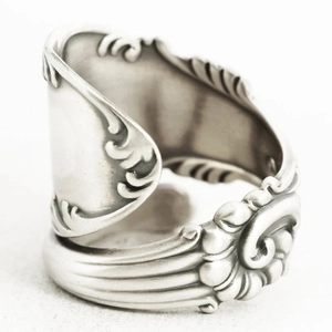 Vintage oxidized silver spoon ring featuring floral relief and adjustable open design