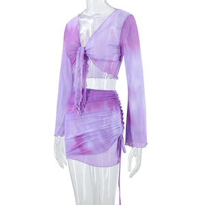 Detail view of purple tie-dye mesh set with V-neck lace-up top and drawstring skirt