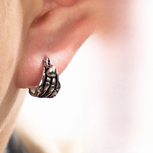 Detailed view of silver punk skeleton hand earrings crafted from durable stainless steel