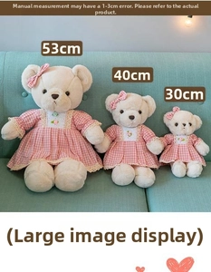 Three pastoral teddy bear plush toys in cream faux fur wearing pink plaid lace dresses