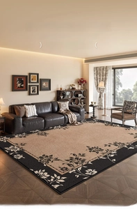 Detail of vintage French style carpet with floral patterns and black border in living room