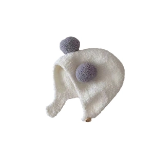 Baby plush earflap hat in white with purple pompoms and a wooden button closure
