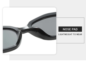 Detail of ergonomic integrated nose pads on black cat-eye sunglasses for lightweight wear