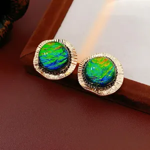 Vintage gold-tone round stud earrings with shimmering iridescent colorful resin stones