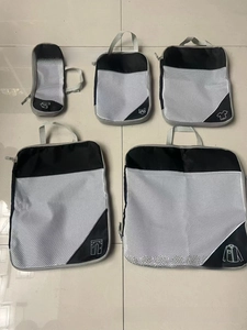 Detailed set of 5 black packing cubes with mesh panels and garment sorting icons