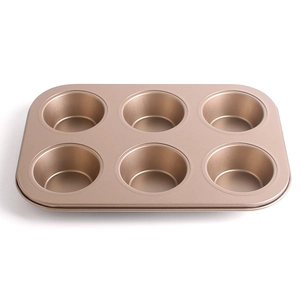 Detailed view of non-stick rose gold carbon steel 6-cup muffin pan for baking