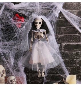 Detailed view of a hanging skeleton bride decoration with tulle gown for Halloween parties