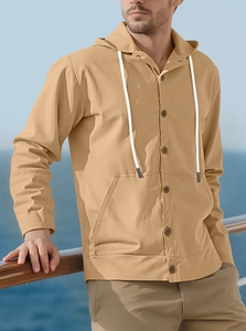 Detail of khaki linen hoodie shirt featuring white drawstrings and large front pockets