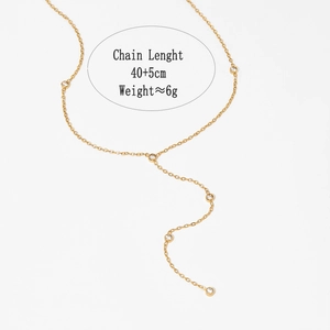 Macro view of gold stainless steel Y-necklace featuring five sparkling zircon pendants