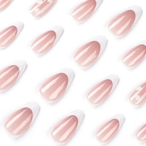 French white almond press-on nails with glitter pink base and small flower details