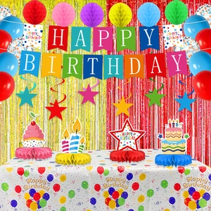 Macro detail of colorful birthday party decor set with banners and honeycomb paper balls
