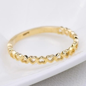 Elegant gold hollow heart-shaped ring with a minimalist continuous design for women