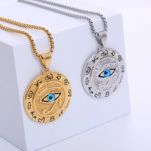 Ancient Egyptian Eye of Horus necklace in gold and silver finish on white background