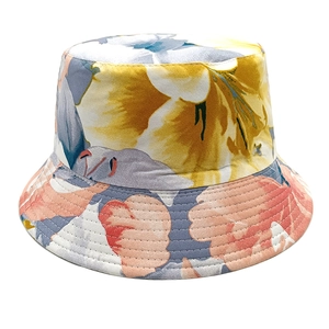 Detailed view of floral pattern and reinforced stitching on a reversible sun hat