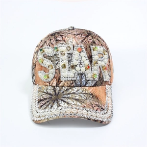 Detail of floral print baseball cap featuring hand-set rhinestones and pearl STAR embroidery