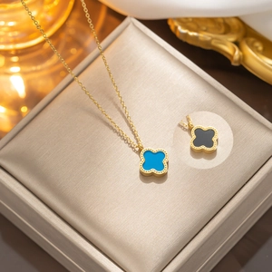 Gold stainless steel four-leaf clover pendant necklace set in blue and black shell
