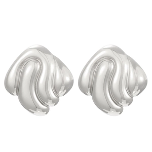 Macro shot of silver polished earrings featuring abstract wavy and shell-like textures