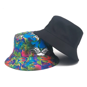 Set of two bucket hats featuring classic black and vibrant tiger head graffiti prints