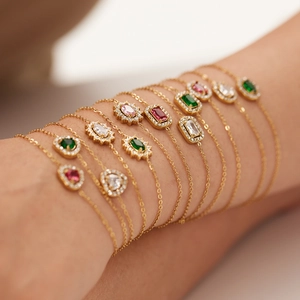 Gold stainless steel bracelet with colorful zircon charms including heart and geometric shapes
