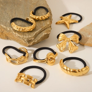 Golden metal hair ties set featuring knot, bow, and chain designs on natural stones