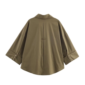 Detail of army green poplin shirt back with drop shoulder design and pleated center seam